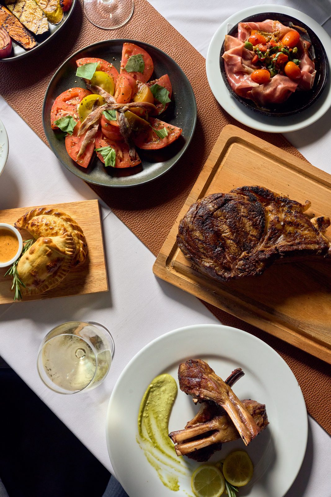 Overhead view of a shared Argentine meal at Graziano's