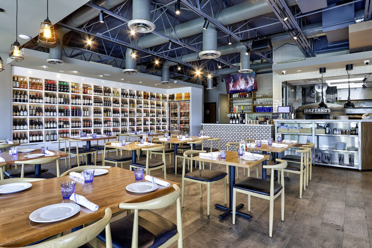 Dining room at Lucia Pizzeria with the wine wall