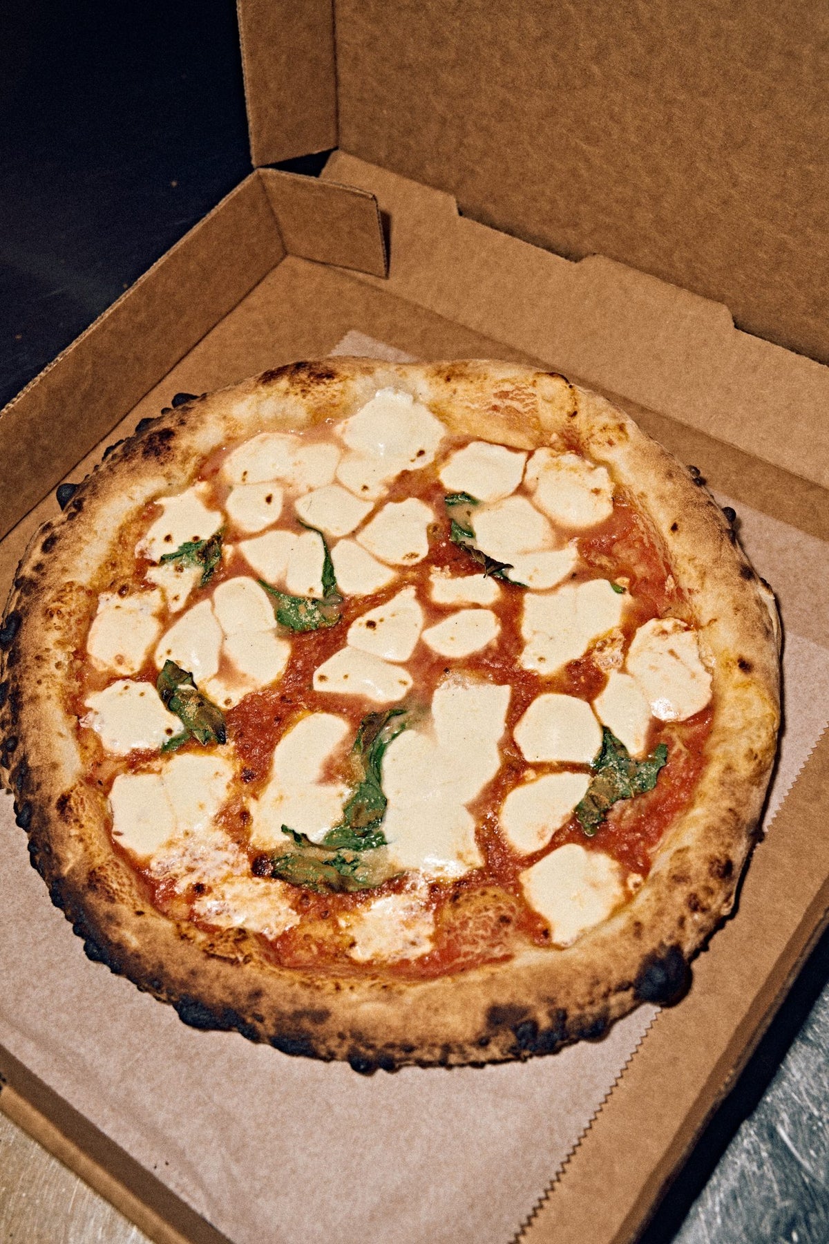 Margherita pizza from Lucia Pizzeria in its box