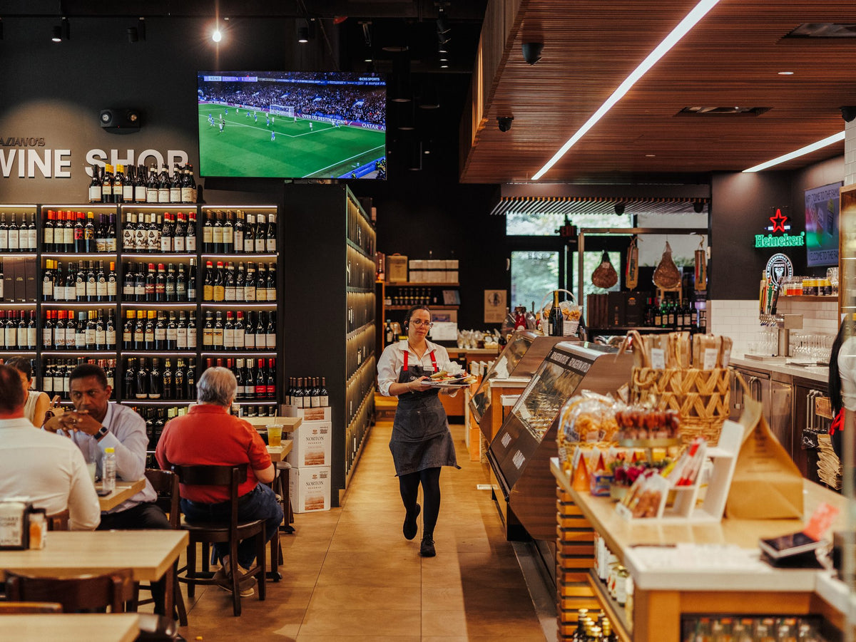Inside Graziano's Mercado, wine shop and tables