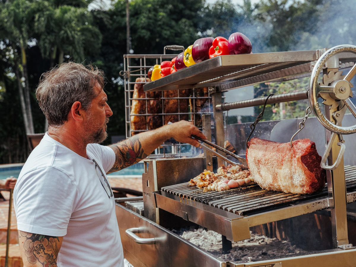 Grilling at an outdoor asado catered by Graziano's
