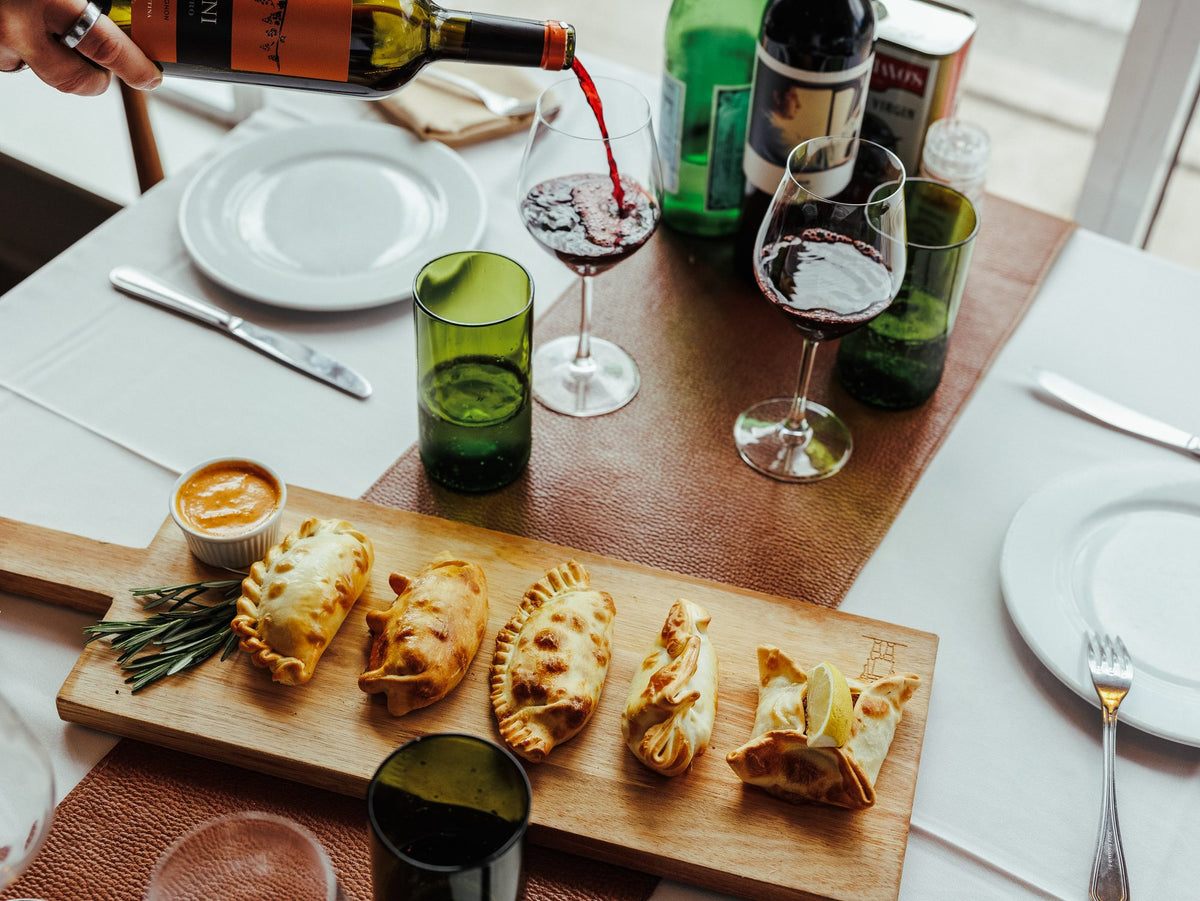 Empanadas and wine on the table at Graziano's