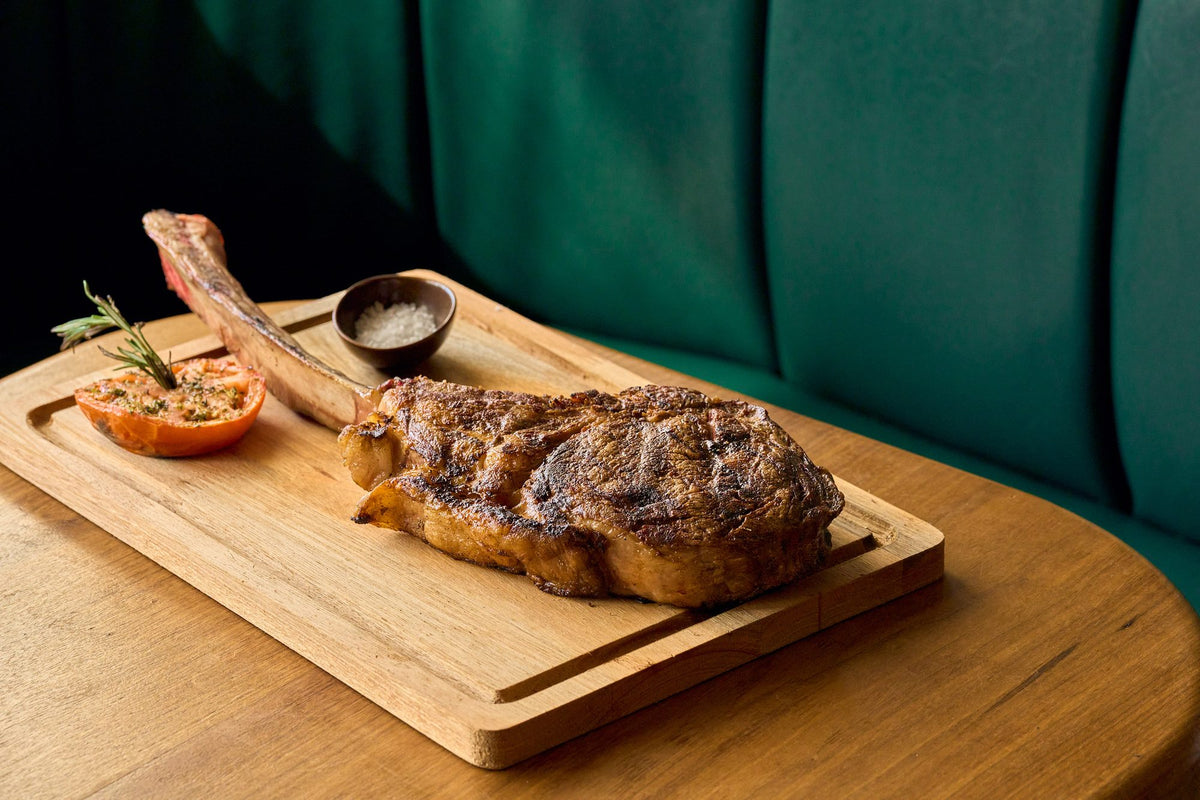 Bone-in ribeye on the board at Graziano's