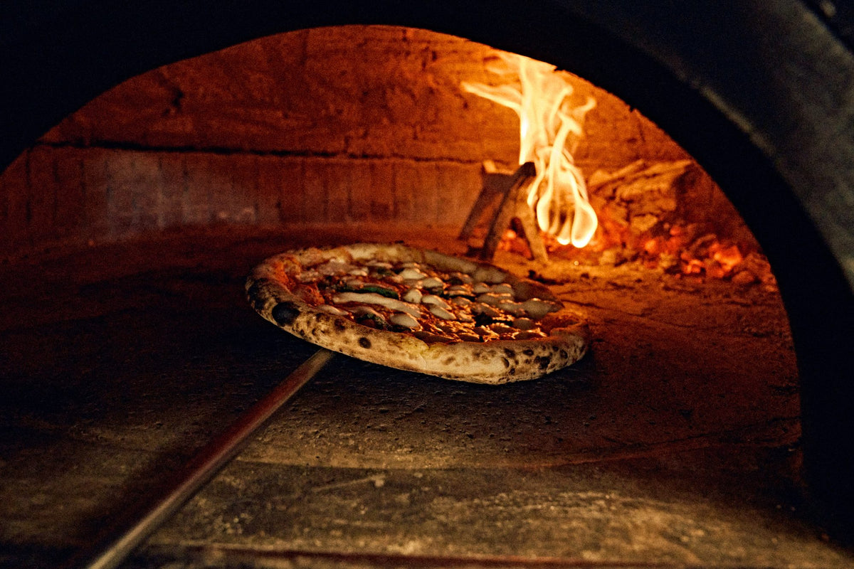 Pizza in the wood-fired oven at Lucia Pizzeria