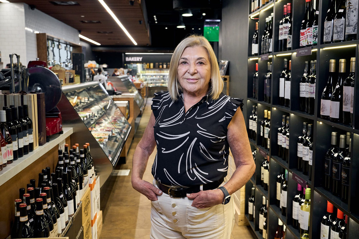Maria shopping the wine shelves at Graziano's Mercado