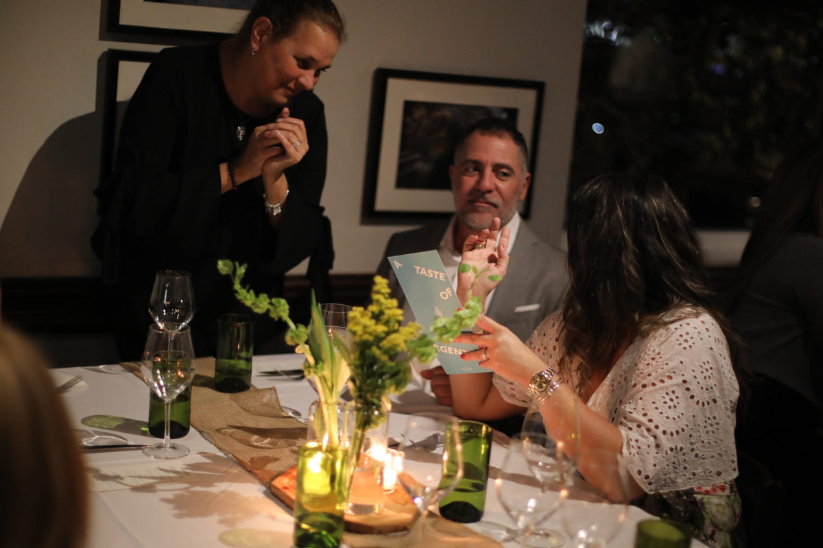 Guests talking over dinner at a private event at Graziano's