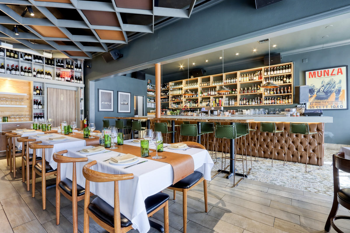 Long table set for a group at Graziano's Coral Gables